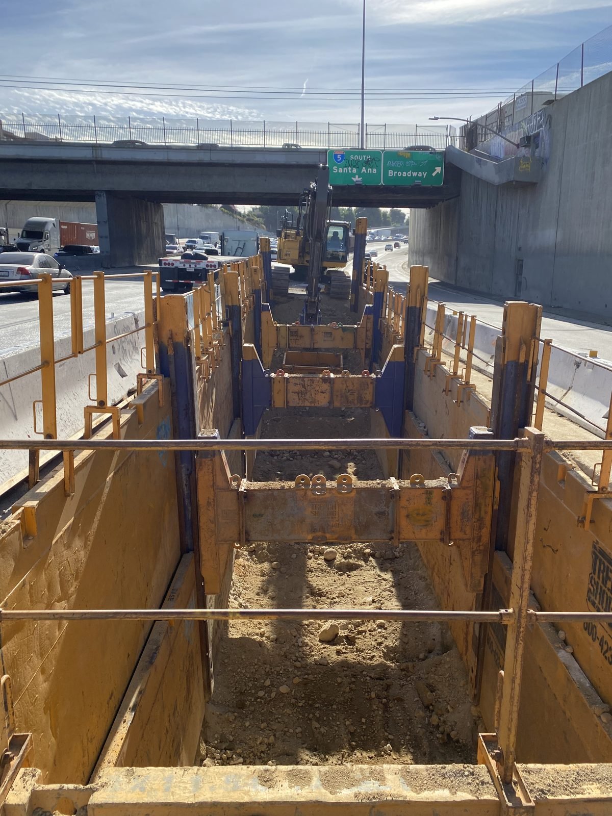 Slide rail shoring for a water storage installation alongside the I-5 freeway