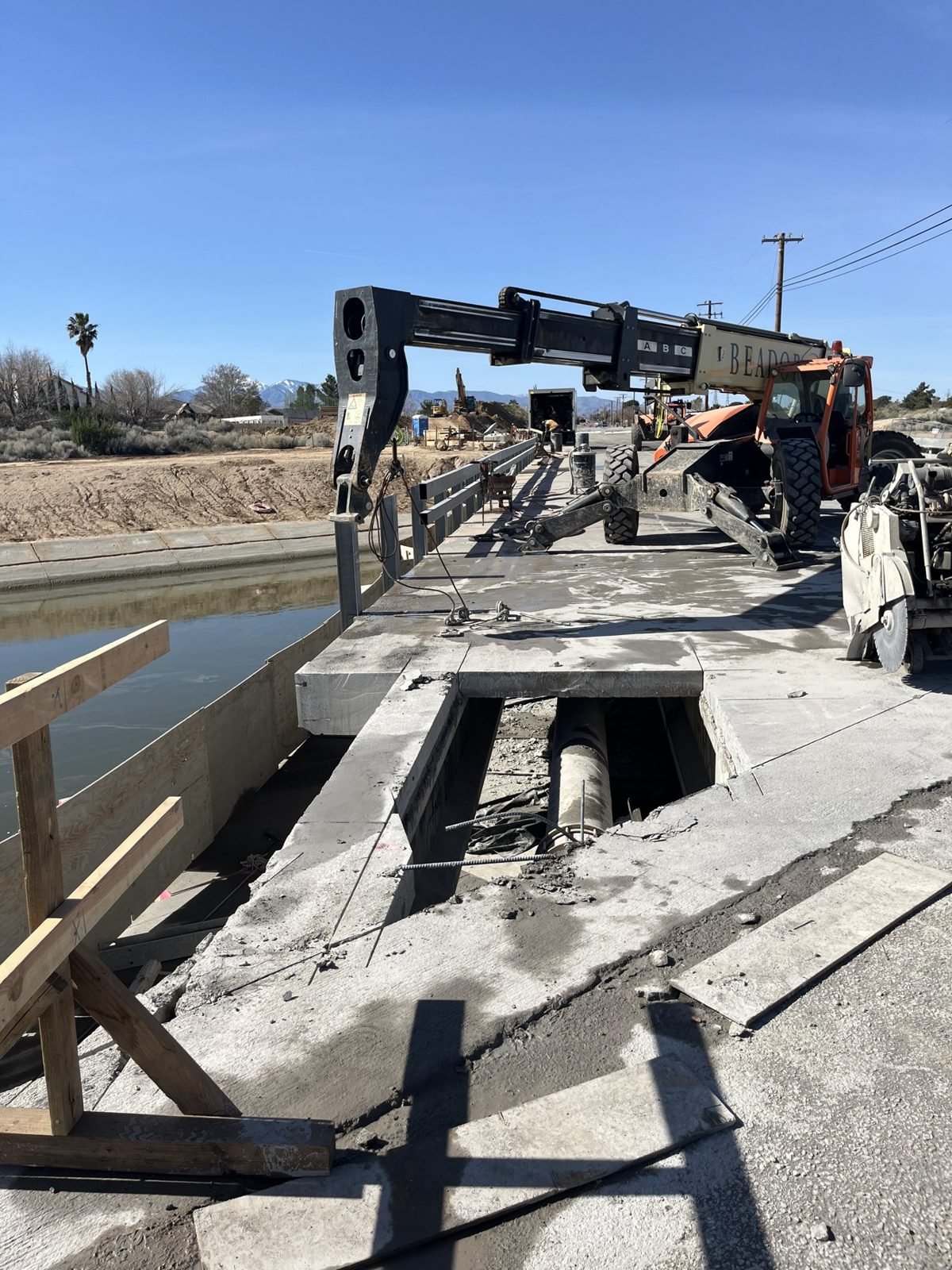 Saw-cut bridge deck being removed over the California Aqueduct