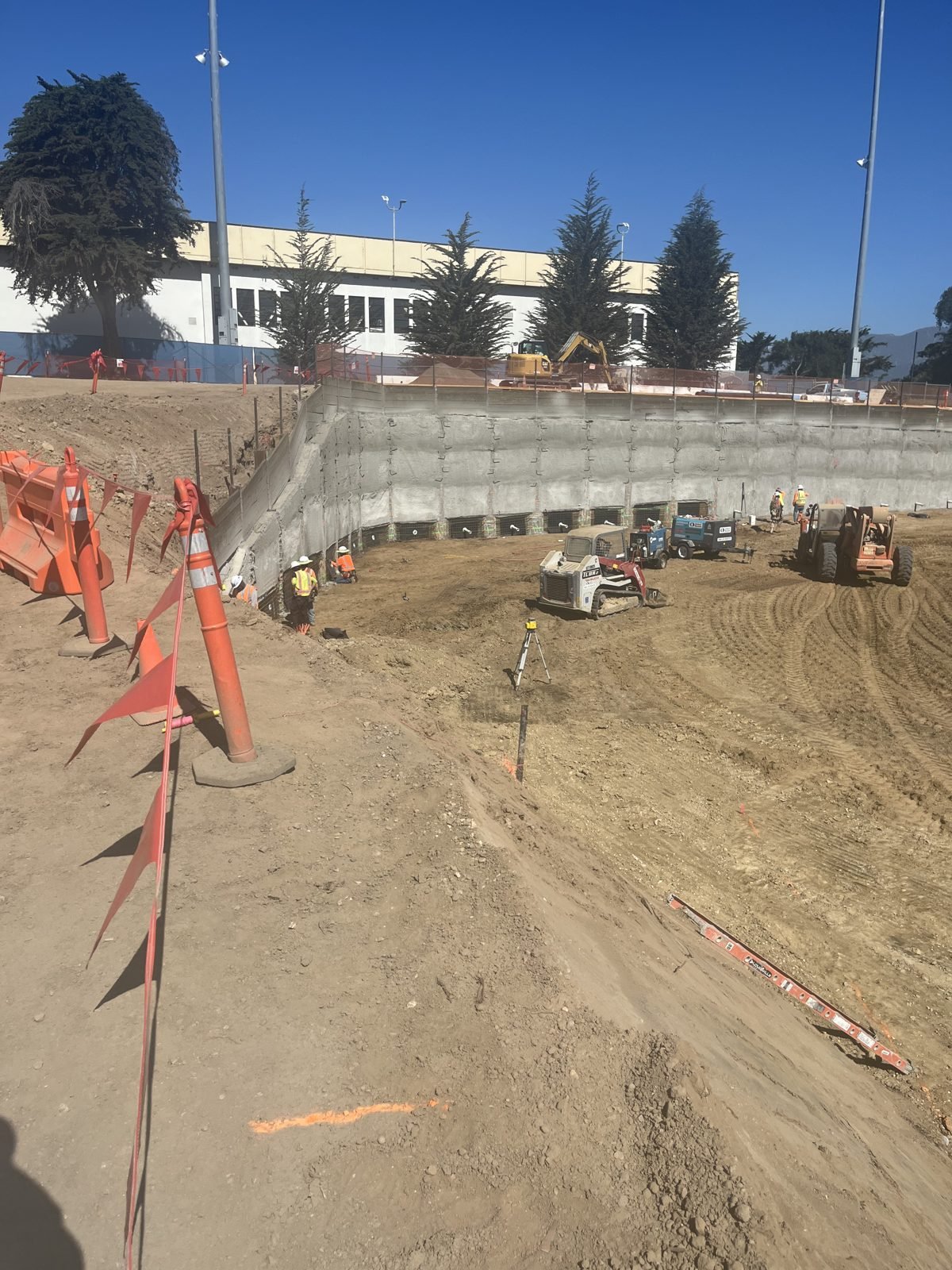 Temporary cantilever pile wall supporting a construction access ramp on a university campus